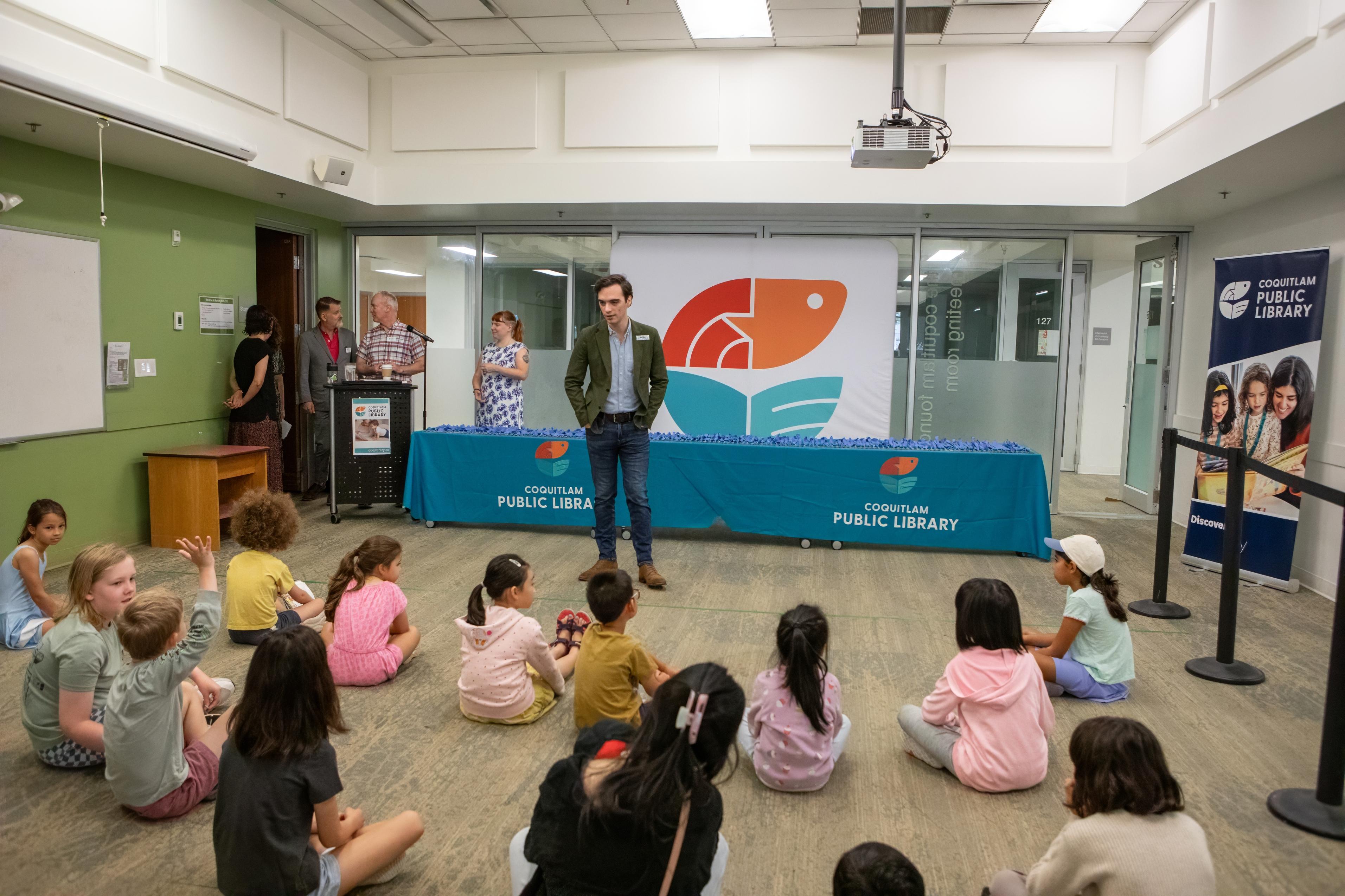 Handing out Summer Reading Club Medals